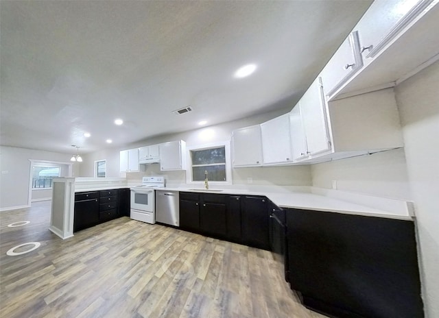 kitchen with white range with electric cooktop, white cabinets, sink, light hardwood / wood-style flooring, and stainless steel dishwasher