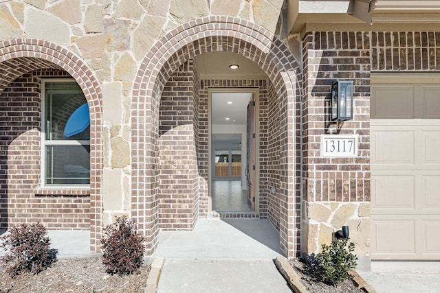 entrance to property featuring a garage