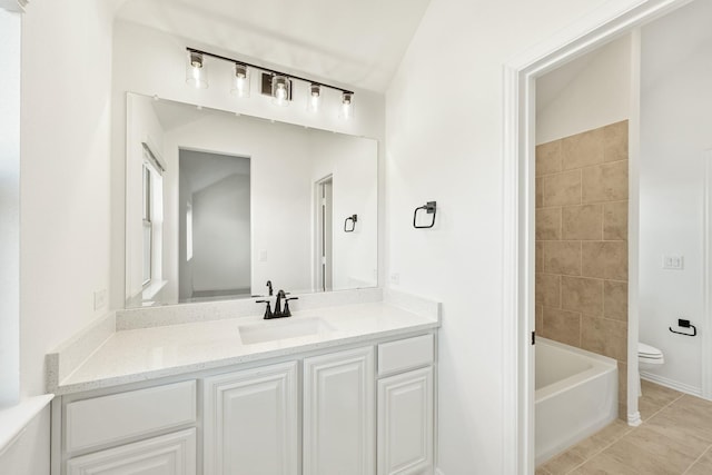 bathroom with vanity, toilet, and tile patterned flooring