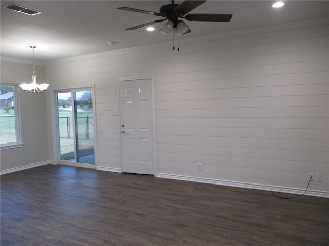 unfurnished room with crown molding, dark hardwood / wood-style floors, and a wealth of natural light