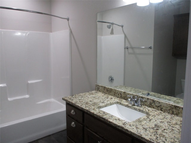 bathroom with vanity and bathtub / shower combination