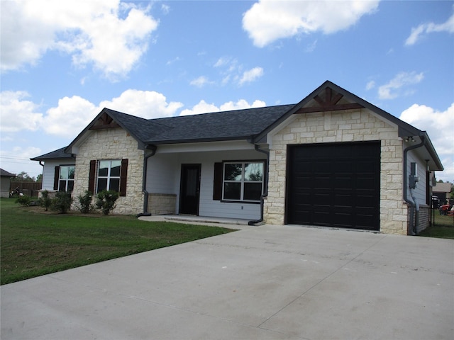 view of front of house with a garage and a front lawn