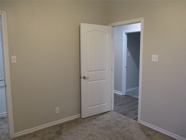 unfurnished room with carpet floors