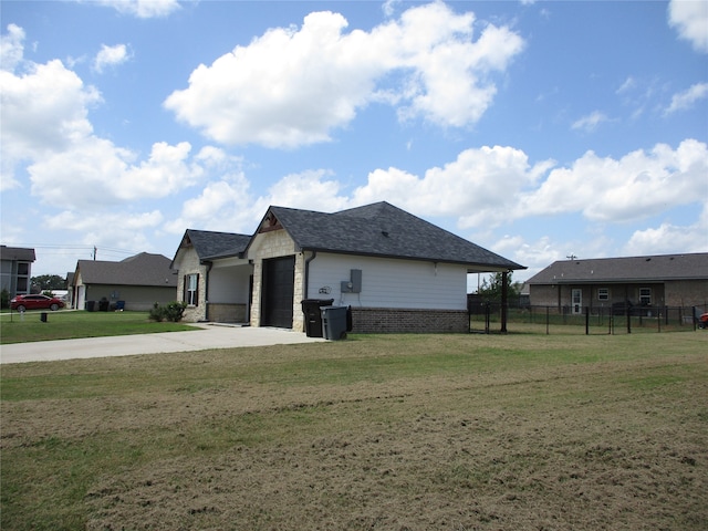 exterior space with a garage and a yard