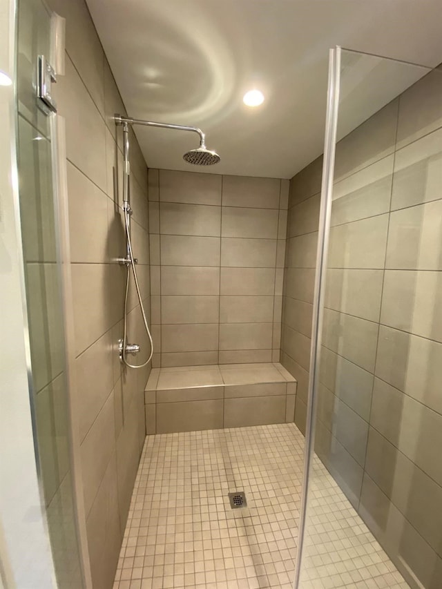 bathroom with a tile shower