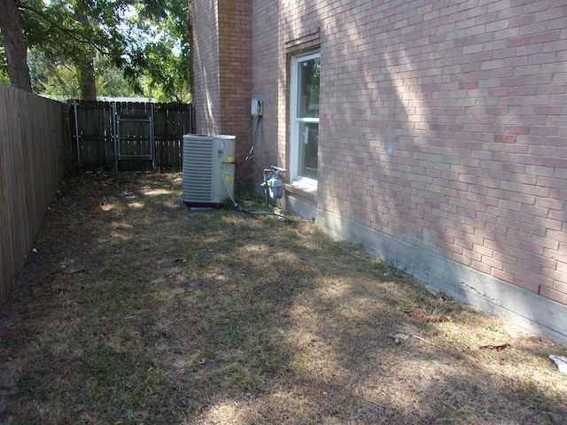 view of yard with central AC