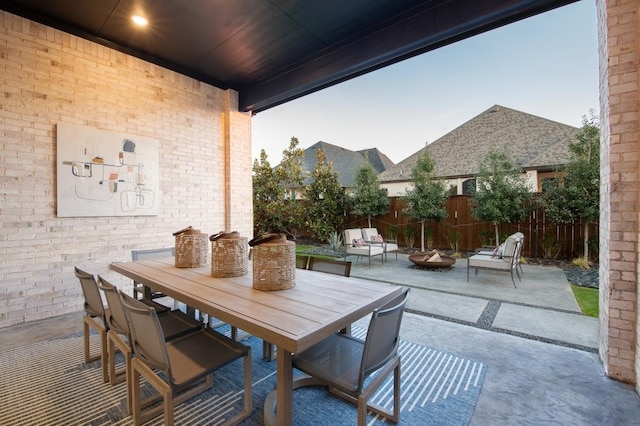 1417 Vermillion Dr, Prosper, TX 75078 - view of patio / terrace with outdoor dining space, fence, and a fire pit