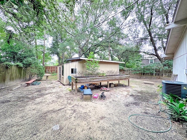 view of patio featuring an outbuilding