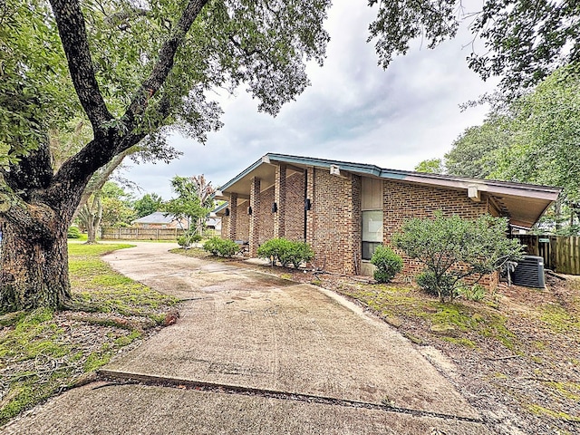 view of front of home with cooling unit