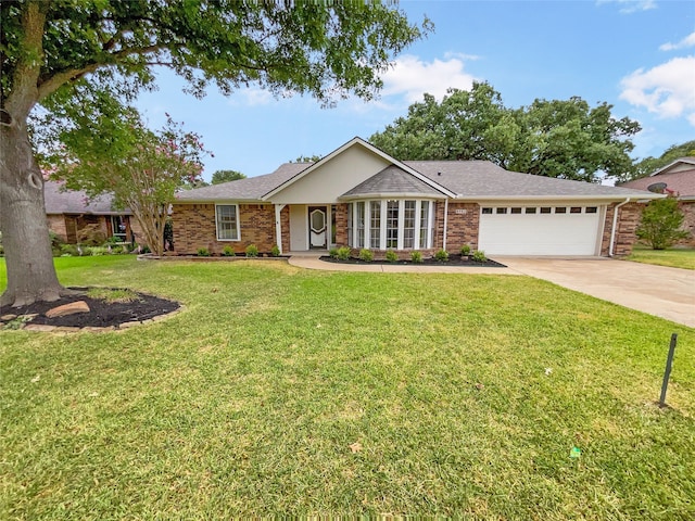 ranch-style house featuring a garage and a front yard