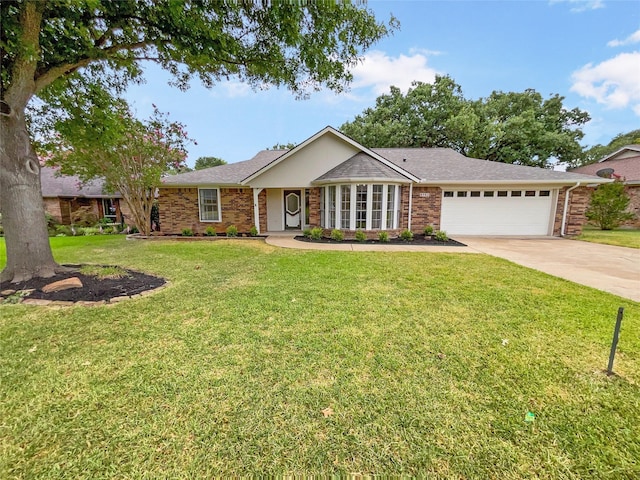 single story home featuring a garage and a front yard