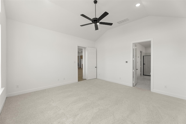 unfurnished bedroom with ceiling fan, light carpet, and lofted ceiling