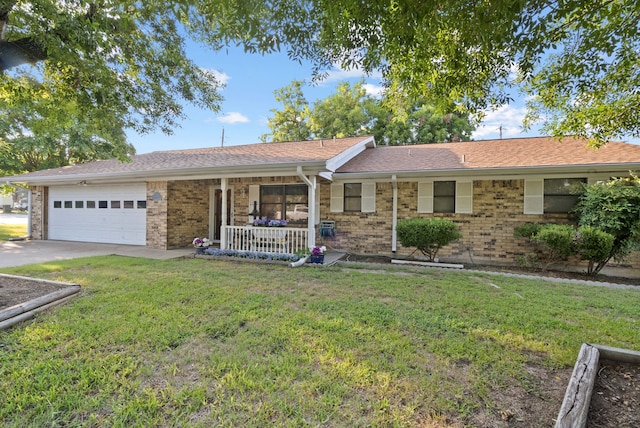 single story home with a porch, a garage, and a front lawn