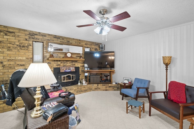 carpeted living room featuring ceiling fan, brick wall, and a textured ceiling