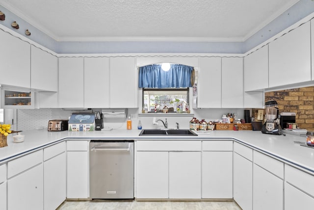 kitchen with sink, white cabinetry, crown molding, a textured ceiling, and stainless steel dishwasher