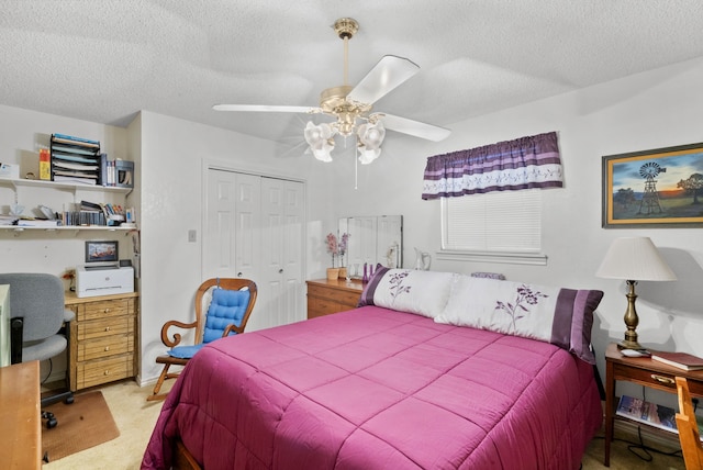 carpeted bedroom featuring a textured ceiling, ceiling fan, and a closet