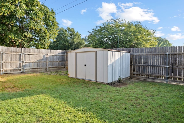 view of outbuilding featuring a lawn