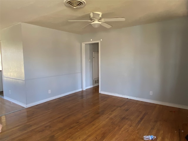 spare room with hardwood / wood-style flooring and ceiling fan