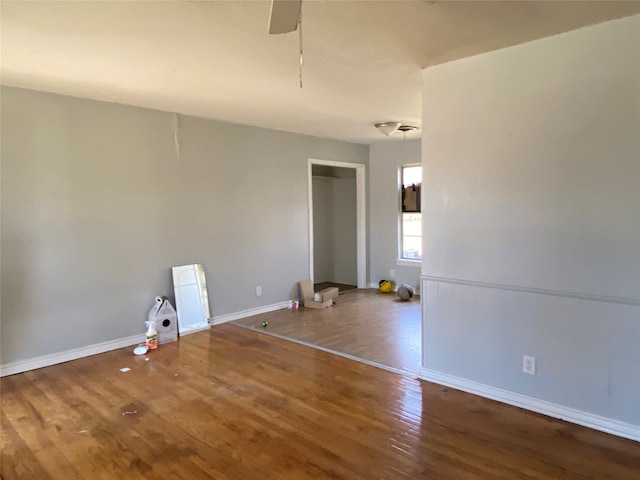 spare room with ceiling fan and hardwood / wood-style floors