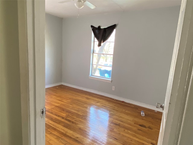 unfurnished room featuring ceiling fan and wood-type flooring