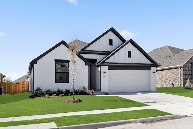 view of front facade with a garage and a front yard