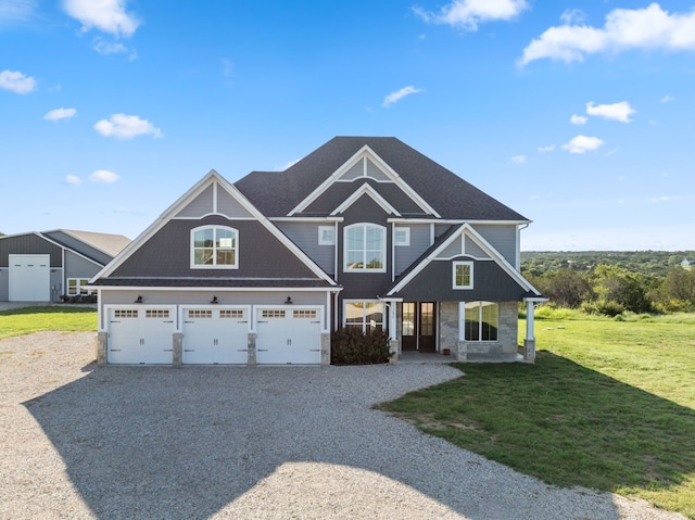 craftsman-style house with a garage and a front yard