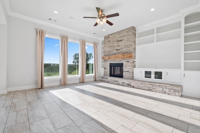 unfurnished living room with a stone fireplace, ceiling fan, built in features, and ornamental molding