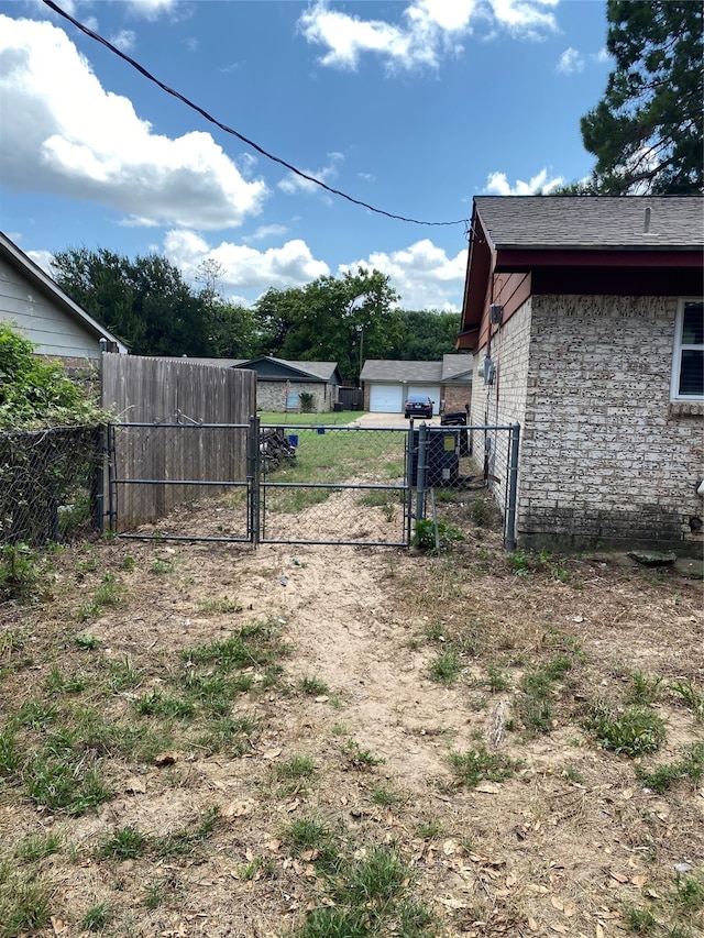 view of yard featuring a garage