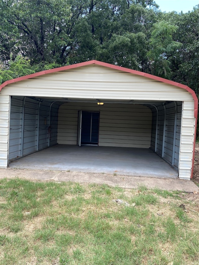 garage featuring a carport