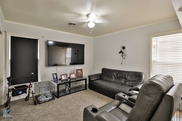 carpeted living room featuring ceiling fan and crown molding