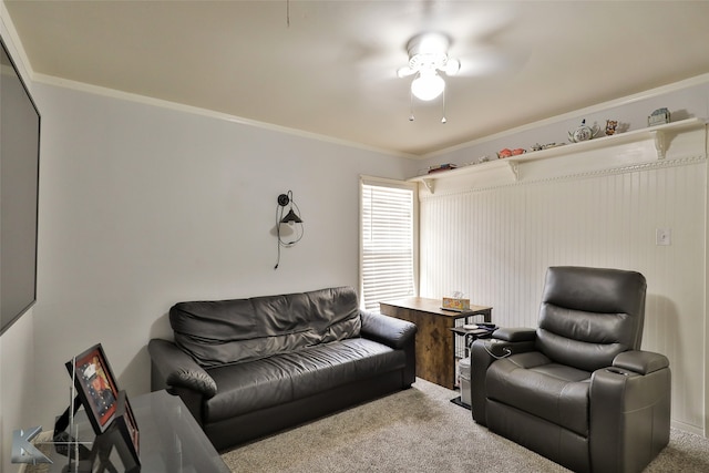 living room featuring ceiling fan, carpet, and ornamental molding