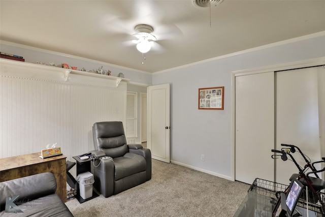 living area featuring ceiling fan, ornamental molding, and carpet floors