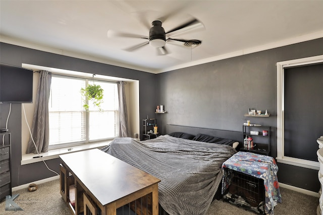 bedroom with ceiling fan and dark colored carpet