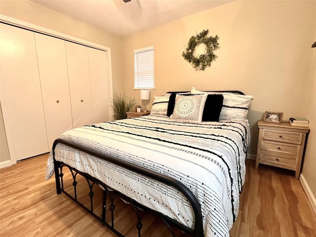 bedroom featuring a closet and light wood-type flooring