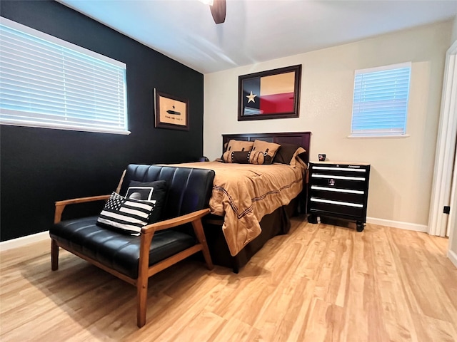 bedroom with light wood-type flooring and ceiling fan