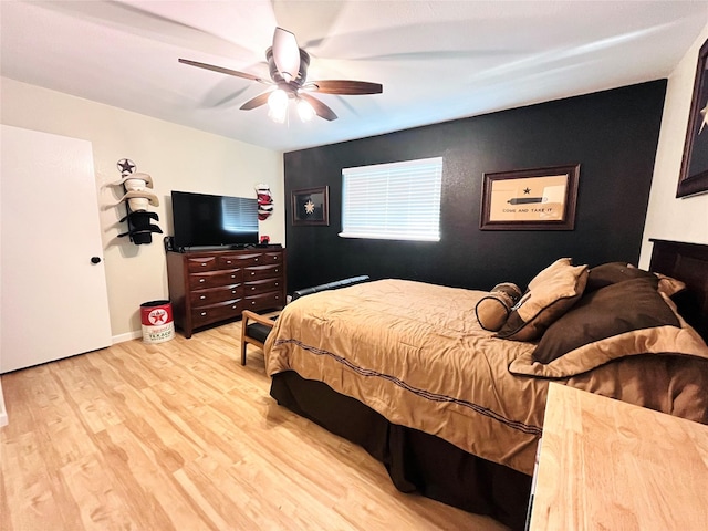 bedroom featuring light hardwood / wood-style flooring and ceiling fan