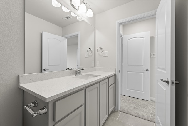 bathroom with vanity and tile patterned flooring