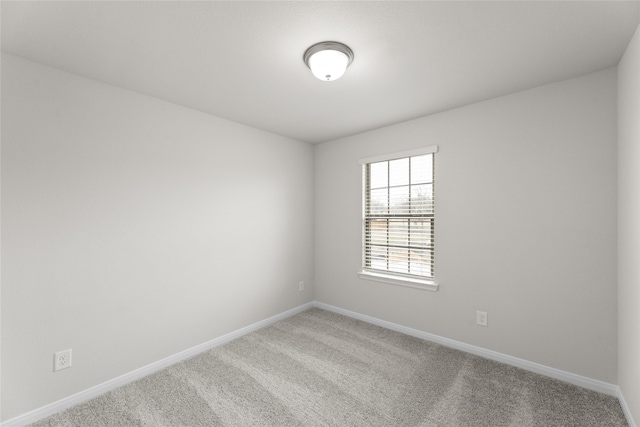 unfurnished room with carpet floors