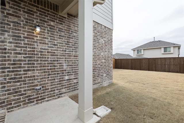 doorway to property featuring a yard