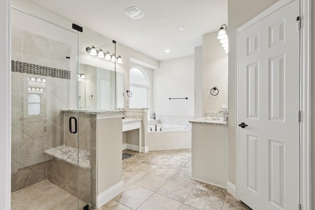 bathroom featuring vanity and plus walk in shower