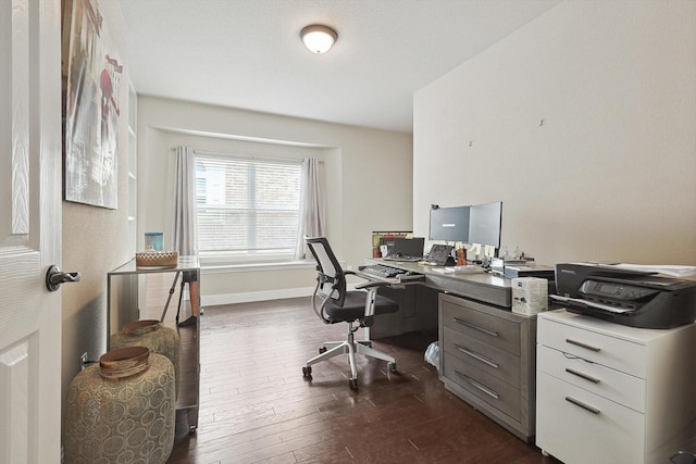 home office with dark hardwood / wood-style floors