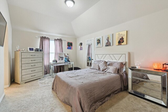 unfurnished room featuring lofted ceiling, light carpet, and ceiling fan