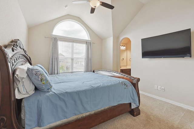 carpeted bedroom with vaulted ceiling, connected bathroom, and ceiling fan