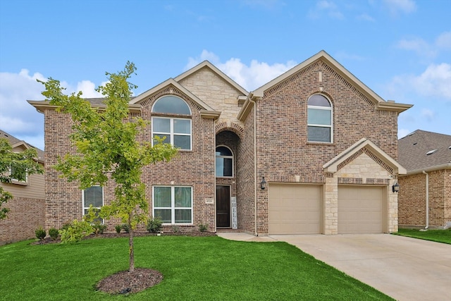 view of front of property with a garage and a front yard