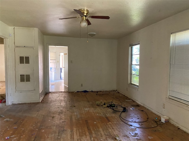 spare room featuring ceiling fan and hardwood / wood-style floors