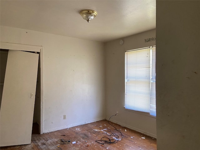 unfurnished bedroom with hardwood / wood-style floors