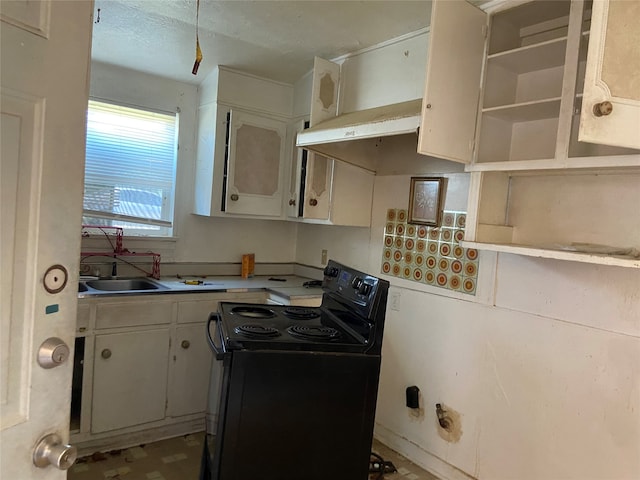 kitchen featuring black electric range, white cabinetry, light tile patterned flooring, wall chimney exhaust hood, and sink