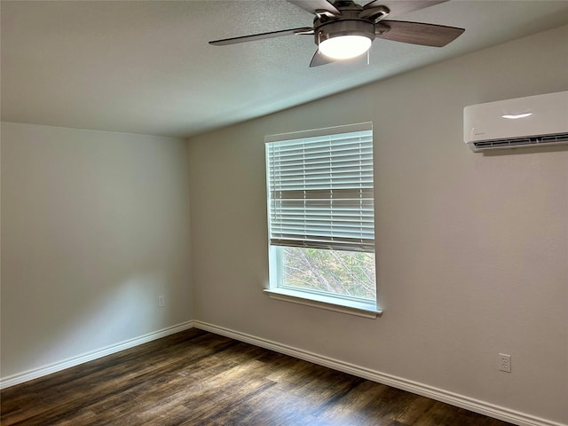 334 Fort Graham Rd, Whitney, TX 76692 - unfurnished room with a wall unit AC, dark wood-type flooring, baseboards, and a ceiling fan