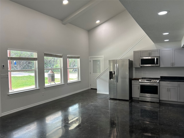 kitchen featuring high vaulted ceiling, appliances with stainless steel finishes, beamed ceiling, and gray cabinets