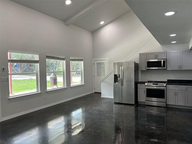 334 Fort Graham Rd, Whitney, TX 76692 - kitchen with stainless steel appliances, gray cabinetry, a towering ceiling, dark countertops, and baseboards